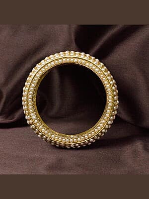 Large form bangle with freshwater pearl embeds